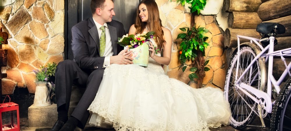 charming bride and groom on porch of house